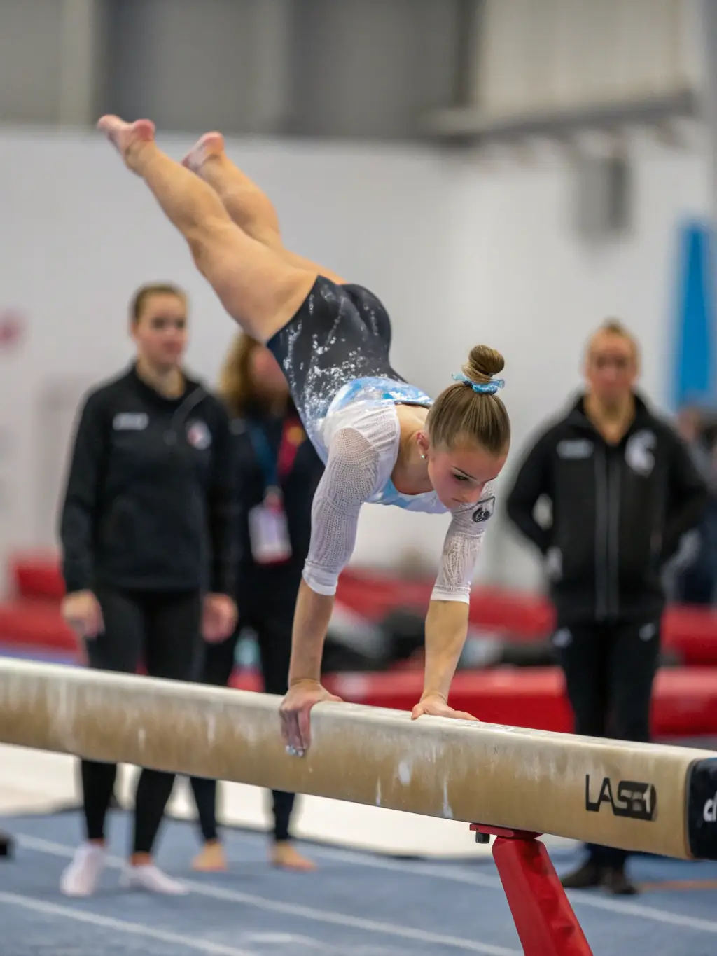 A person successfully completing a gymnastics routine, displaying confidence and achievement.